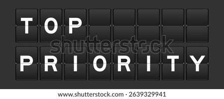 Black color analog flip board with word top priority on gray background
