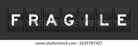 Black color analog flip board with word fragile on gray background