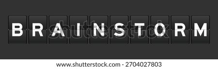 Black color analog flip board with word brainstorm on gray background