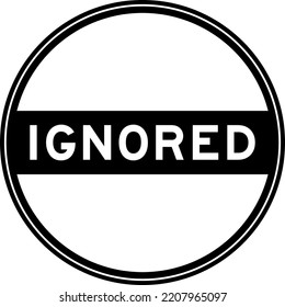 Black color round seal sticker in word ignored on white background