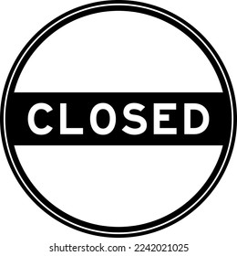 Black color round seal sticker in word closed on white background