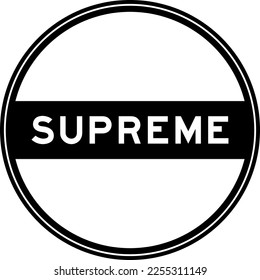 Black color round seal sticker in word supreme on white background