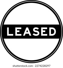 Black color round seal sticker in word leased on white background