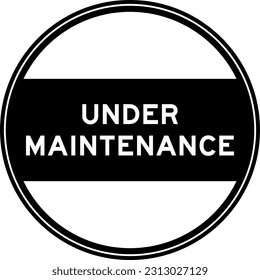 Black color round seal sticker in word under maintenance on white background