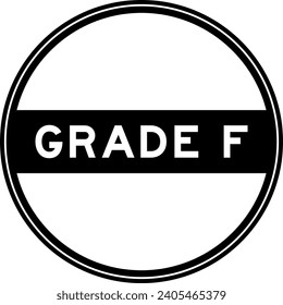 Black color round seal sticker in word grade F on white background