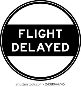 Black color round seal sticker in word flight delayed on white background