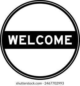 Black color round seal sticker in word welcome on white background