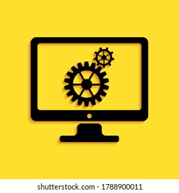 Black Computer monitor and gears icon isolated on yellow background. Adjusting app, service, setting options, maintenance, repair, fixing concepts. Long shadow style. Vector.