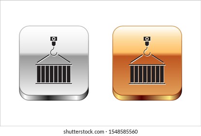 Black Container on crane icon isolated on white background. Crane lifts a container with cargo. Silver-gold square button. Vector Illustration