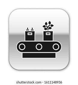 Black Conveyor belt with cardboard box icon isolated on white background. Silver square button. Vector Illustration