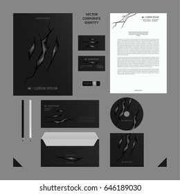 Black Corporate Identity set with abstract polygonal illustration in cracked background.