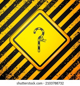 Black Crook icon isolated on yellow background. Ancient Egypt symbol. Scepters of egypt. Warning sign. Vector