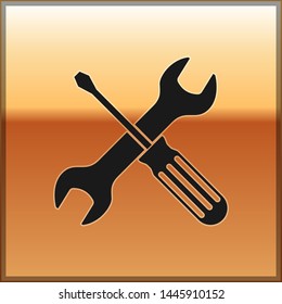 Black Crossed screwdriver and wrench tools icon isolated on gold background. Service tool symbol.  Vector Illustration