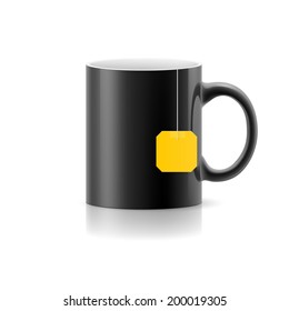 Black cup with tea bag label from standing on white background