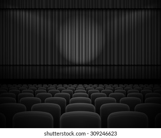 Black curtain from the theatre with a spotlight and row chairs
