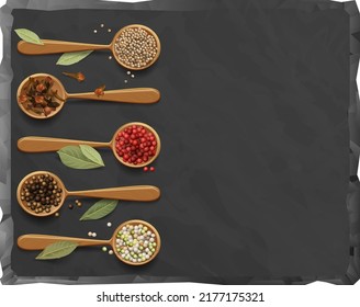 A black cutting board with a highlighted stone texture on a white background with a composition of wooden spoons with colorful peppers, coriander seeds and bay leaf.