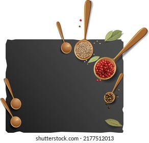 A black cutting board with a highlighted stone texture on a white background with a composition of wooden spoons with colorful peppers, coriander seeds and bay leaf.