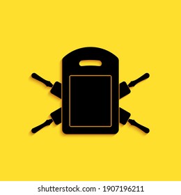 Black Cutting board and rolling pins icon isolated on yellow background. Kitchen utensils and equipment. Long shadow style. Vector.