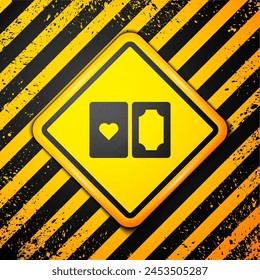 Black Deck of playing cards icon isolated on yellow background. Casino gambling. Warning sign. Vector