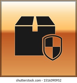 Black Delivery pack security symbol with shield icon isolated on gold background. Delivery insurance. Insured cardboard boxes beyond the shield.  Vector Illustration