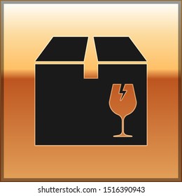 Black Delivery package box with fragile content symbol of broken glass icon isolated on gold background. Box, package, parcel sign.  Vector Illustration