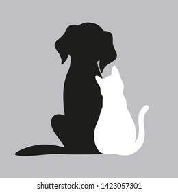 black dog and white cat on a gray background