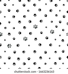 Black doodle paw prints vector seamless background pattern for fabric design