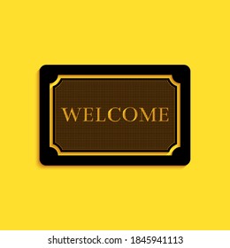 Black Doormat with the text Welcome icon isolated on yellow background. Welcome mat sign. Long shadow style. Vector.