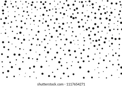 Black dots of different sizes on a white background. Abstract spray pattern. Vector illustration. Black glitter blow explosion and splats on white. Grunge texture. 