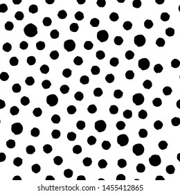 Black dots on white background. Abstract black and white seamless pattern.