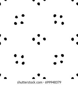 Black dots on white background. Ornamental pattern.