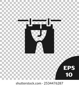 Black Drying clothes icon isolated on transparent background. Clean shirt. Wash clothes on a rope with clothespins. Clothing care and tidiness.  Vector