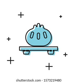 Black Dumpling on cutting board icon isolated on white background. Traditional chinese dish.  Vector Illustration