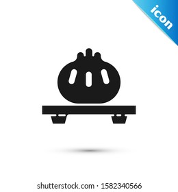 Black Dumpling on cutting board icon isolated on white background. Traditional chinese dish.  Vector Illustration