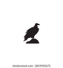 Black eagle silhouette stands on a rock against a plain white background.