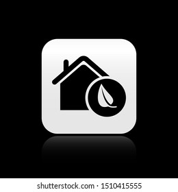 Black Eco friendly house icon isolated on black background. Eco house with leaf. Silver square button. Vector Illustration