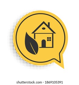 Black Eco friendly house icon isolated on white background. Eco house with leaf. Yellow speech bubble symbol. Vector.
