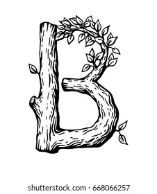 Black engraving Letter B  made of wood with leaves on the white background