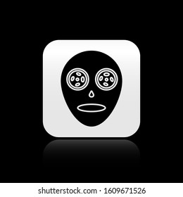 Black Facial cosmetic mask icon isolated on black background. Cosmetology, medicine and health care. Silver square button. Vector Illustration