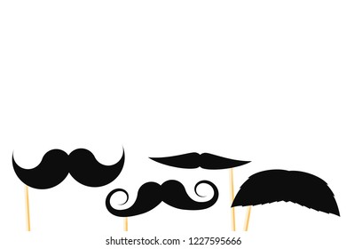 Black fake paper mustaches on a stick on a white background