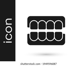 Icono de mandíbula falsa negra aislado en fondo blanco. Jaw dental o dentaduras postizas, dientes falsos con incisivos.  Vector