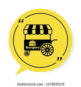 Black Fast street food cart with awning icon isolated on white background. Burger or hamburger icon. Urban kiosk. Yellow speech bubble symbol. Vector Illustration