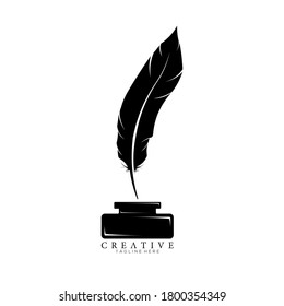 Black Feather Pen Above Ink Holder