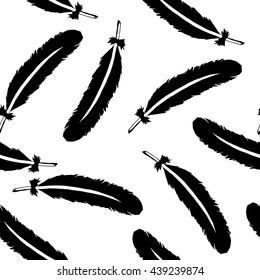 Black feathers on a transparent background; vector pattern