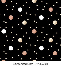 Black festive packaging paper with dots made of gold and bronze foil. Seamless vector pattern.