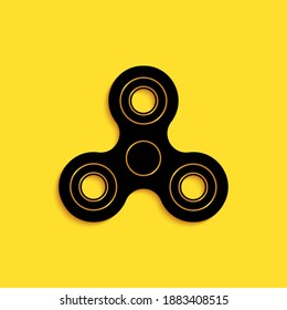 Black Fidget spinner icon isolated on yellow background. Stress relieving toy. Trendy hand spinner. Long shadow style. Vector.