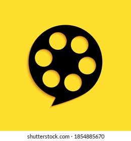 Black Film reel icon isolated on yellow background. Long shadow style. Vector.