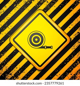 Black Fire hose reel icon isolated on yellow background. Warning sign. Vector