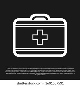 Black First aid kit icon isolated on black background. Medical box with cross. Medical equipment for emergency. Healthcare concept.  Vector Illustration