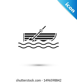 Black Fishing boat with oars on water icon isolated on white background.  Vector Illustration